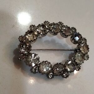 Oval clear stone lapel brooch vintage large and small stones